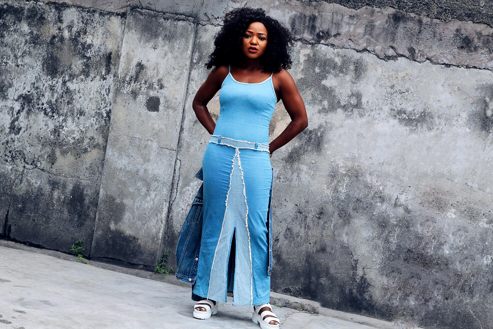 Girl ,her big hair ,wearing denim on denim