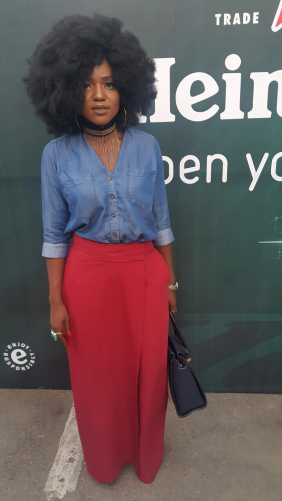 Big hair ,denim shirt,burgundy pants