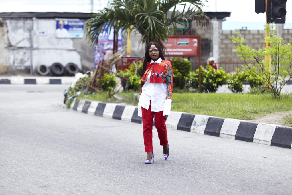 styling white shirt and red pant with vintage cape